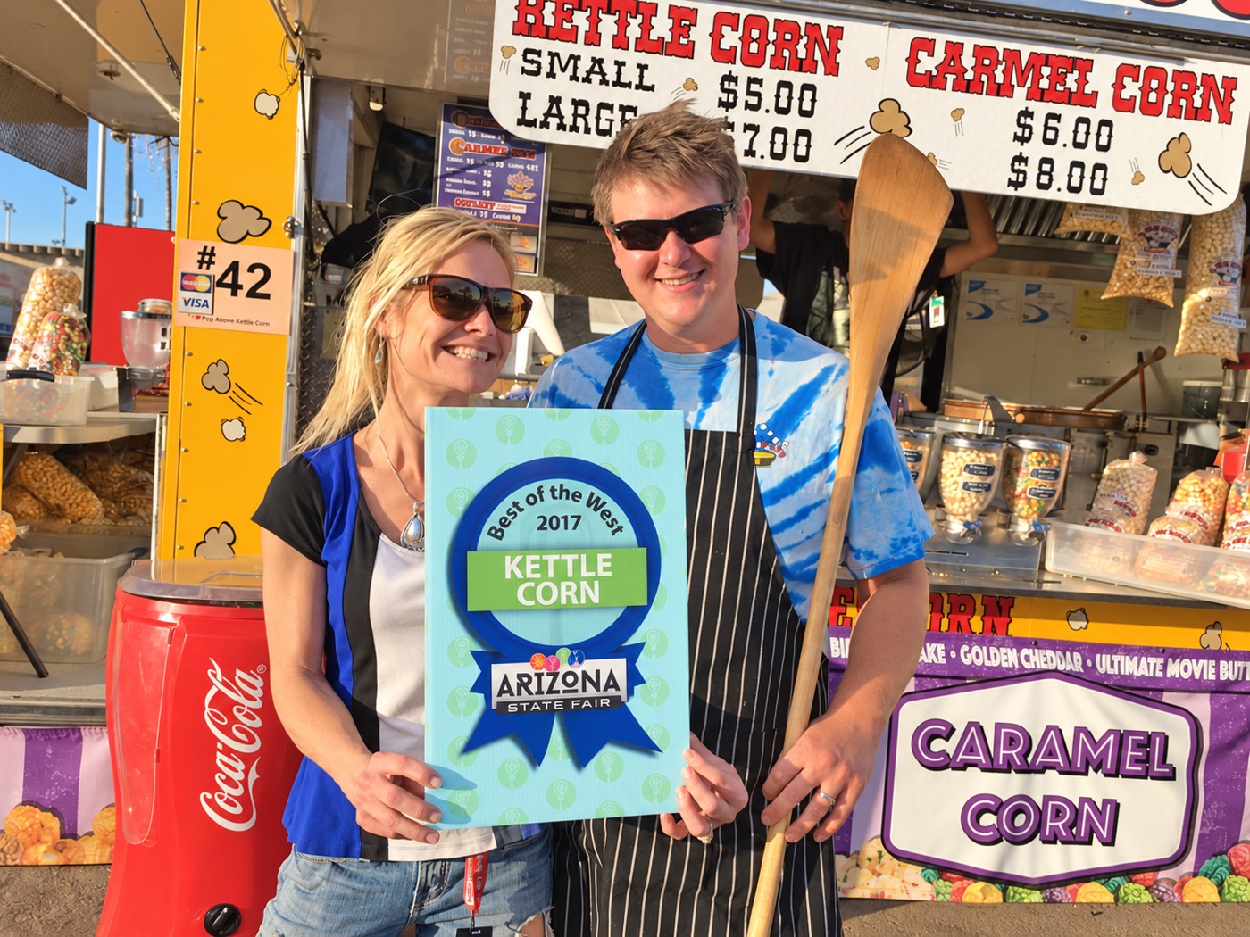 The A Pop Above team holding the 2017 Arizona State Fair Best of the West Kettle Corn award
