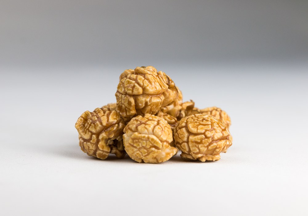 Close-up of A Pop Above caramel corn with a golden caramel coating